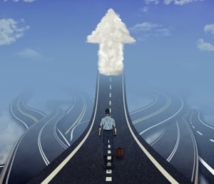 Career development business concept. Business man standing in front of many tangled roads with one highway leading up to arrow cloud as metaphor for leadership.-1