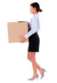 Business woman moving and holding cardboard box - isolated