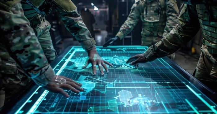military personnel viewing large digital screen