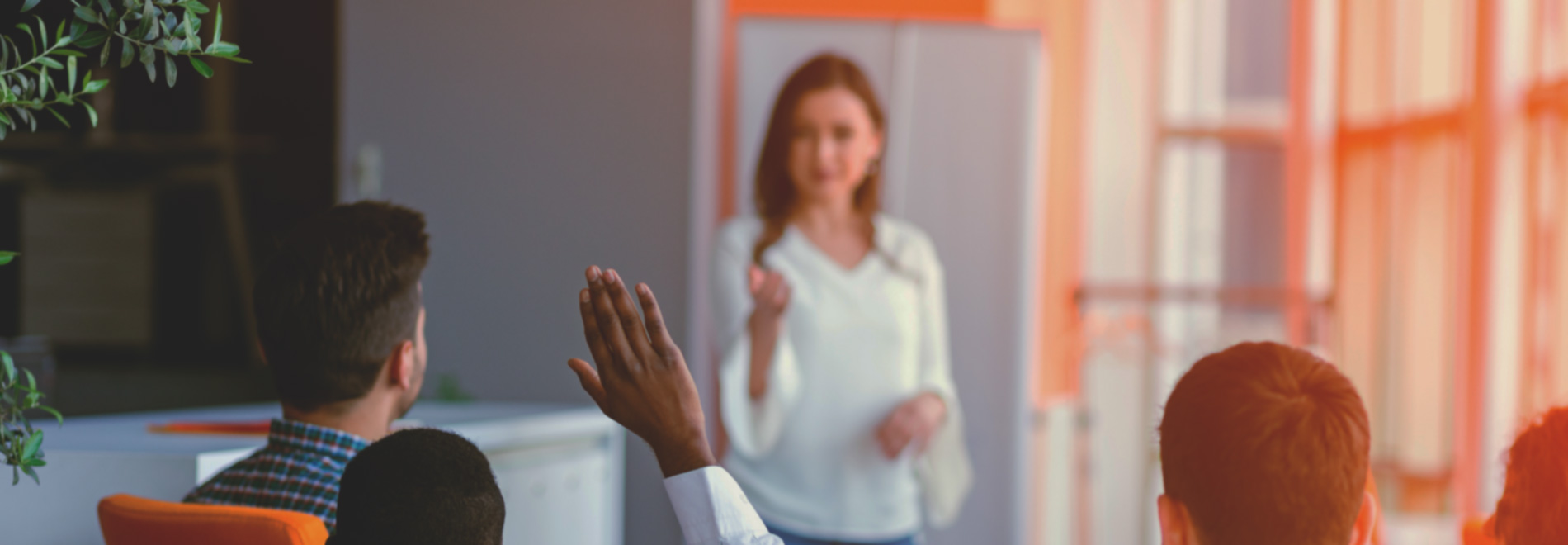man-raising-hand-to-ask-speaker-a-question (desktop)